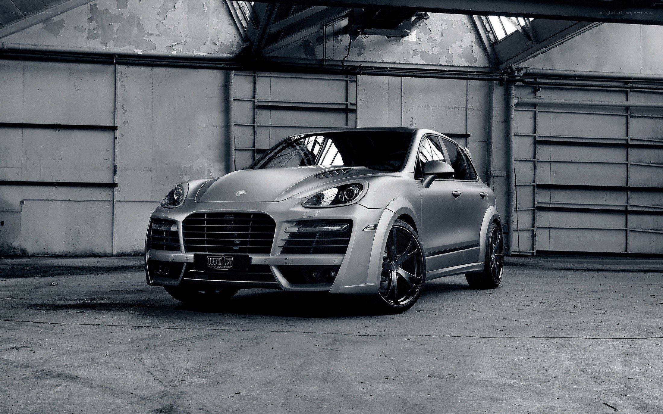 silver porsche cayenne in garage