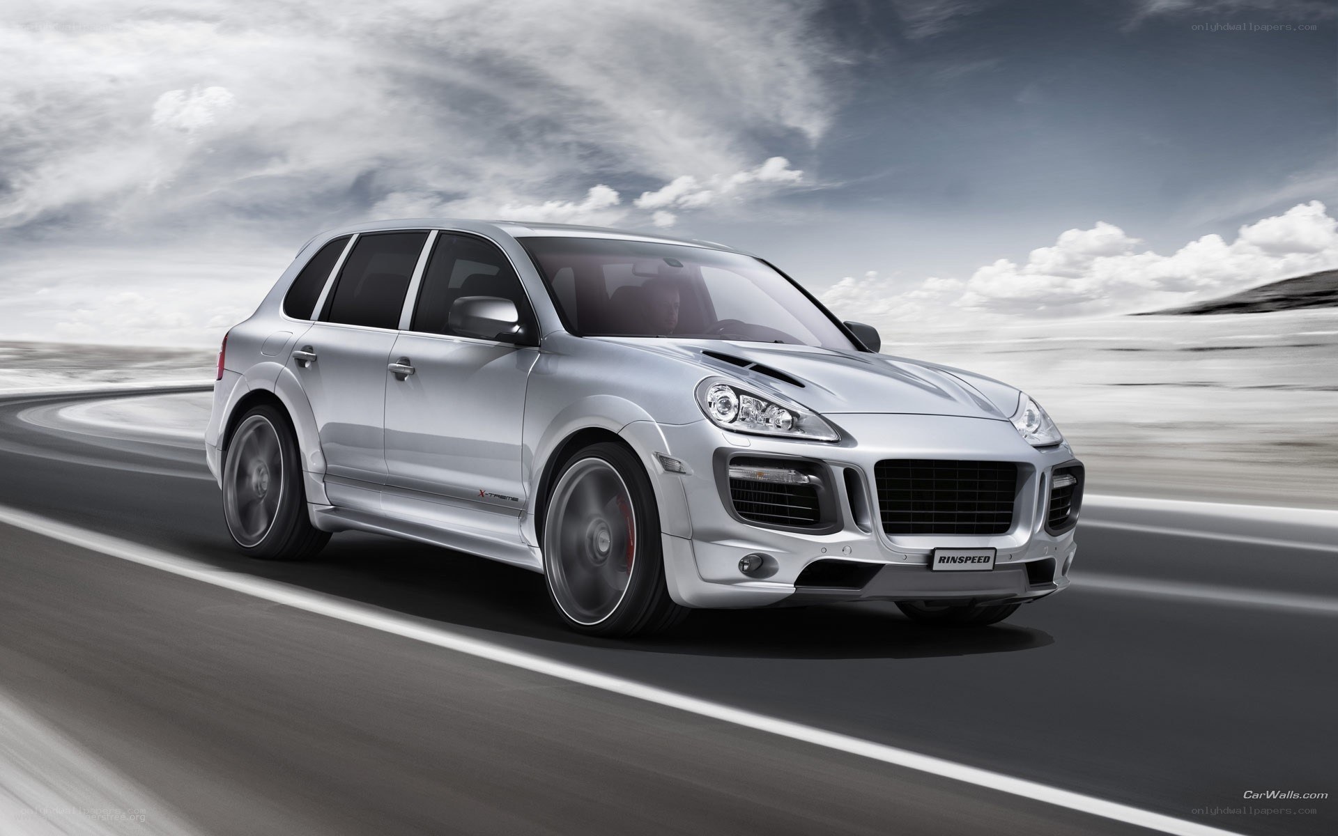 silver porsche cayenne in motion