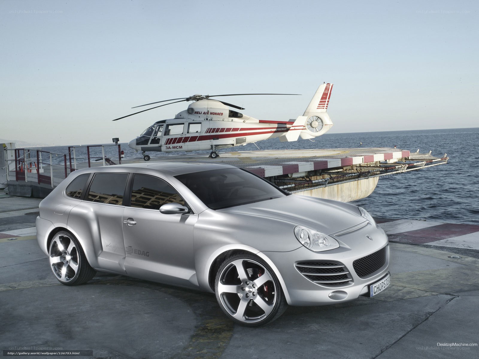 Silver Porsche Cayenne on helipad