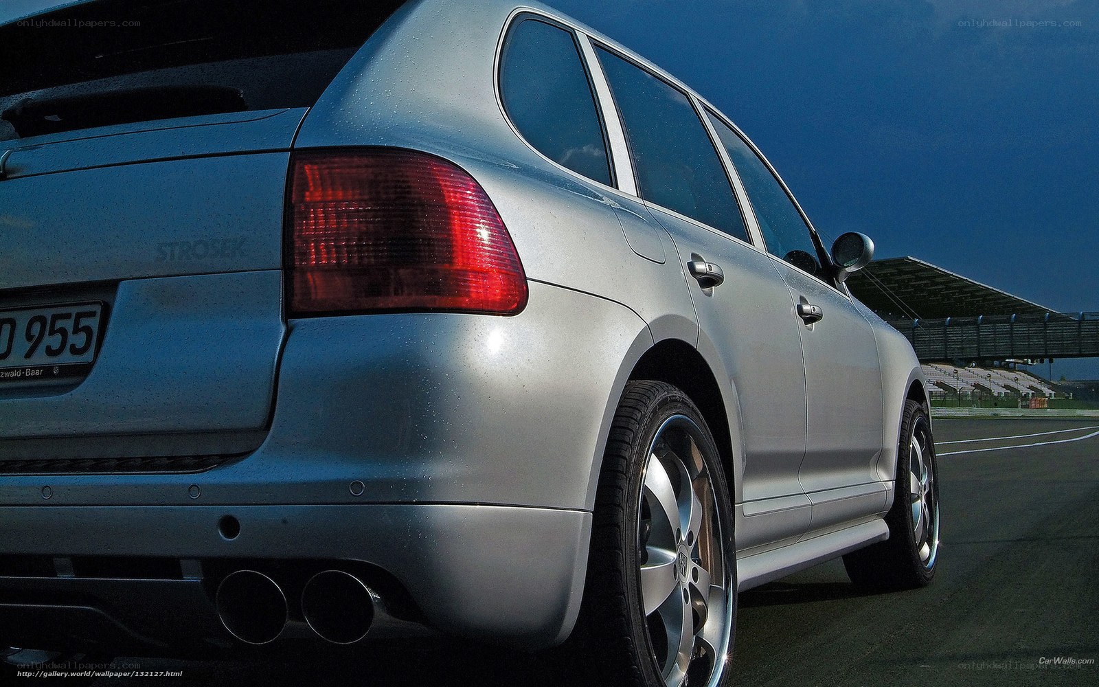 silver porsche cayenne on track
