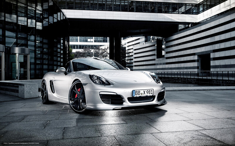 Silver Porsche Cayman in urban setting
