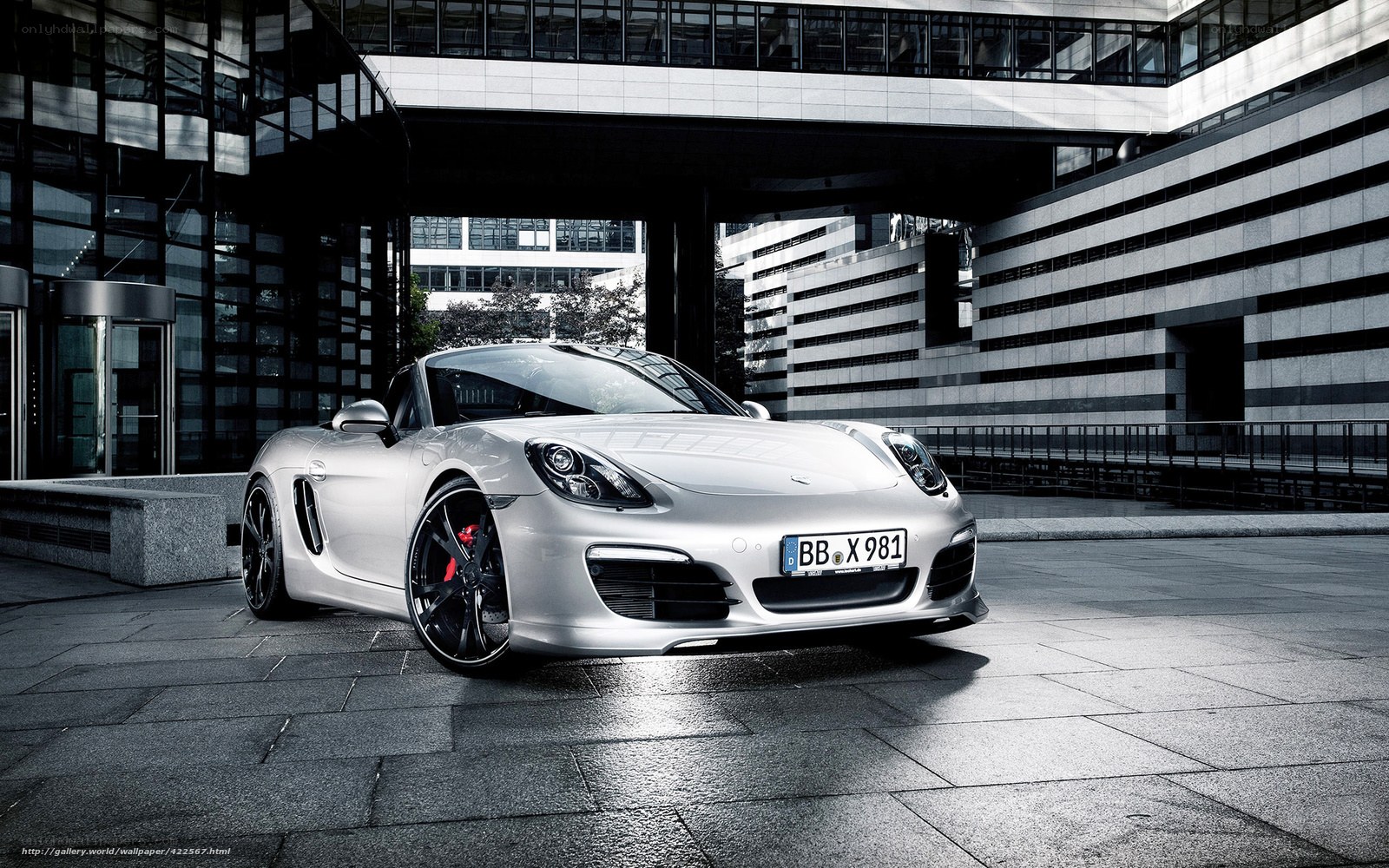Silver Porsche Cayman in urban setting