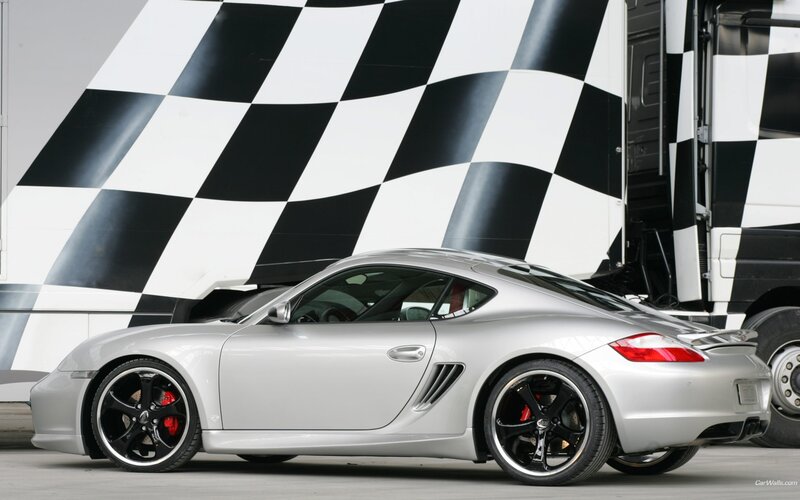 Silver Porsche Cayman with checkered flag