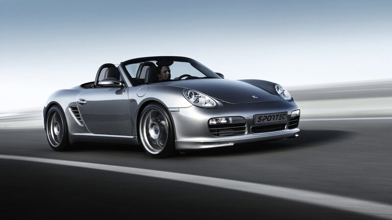Silver Porsche convertible in motion