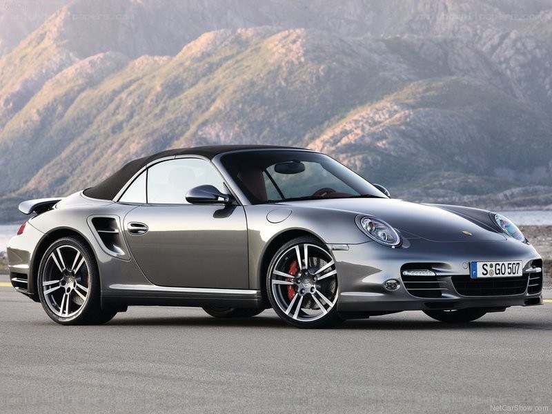 Silver Porsche convertible on road