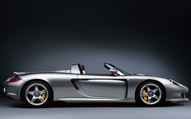 silver porsche convertible sports car