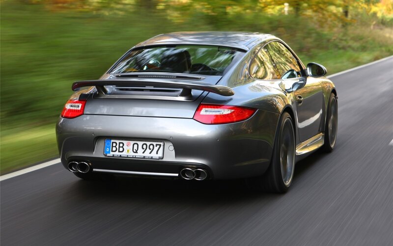 silver porsche driving on road