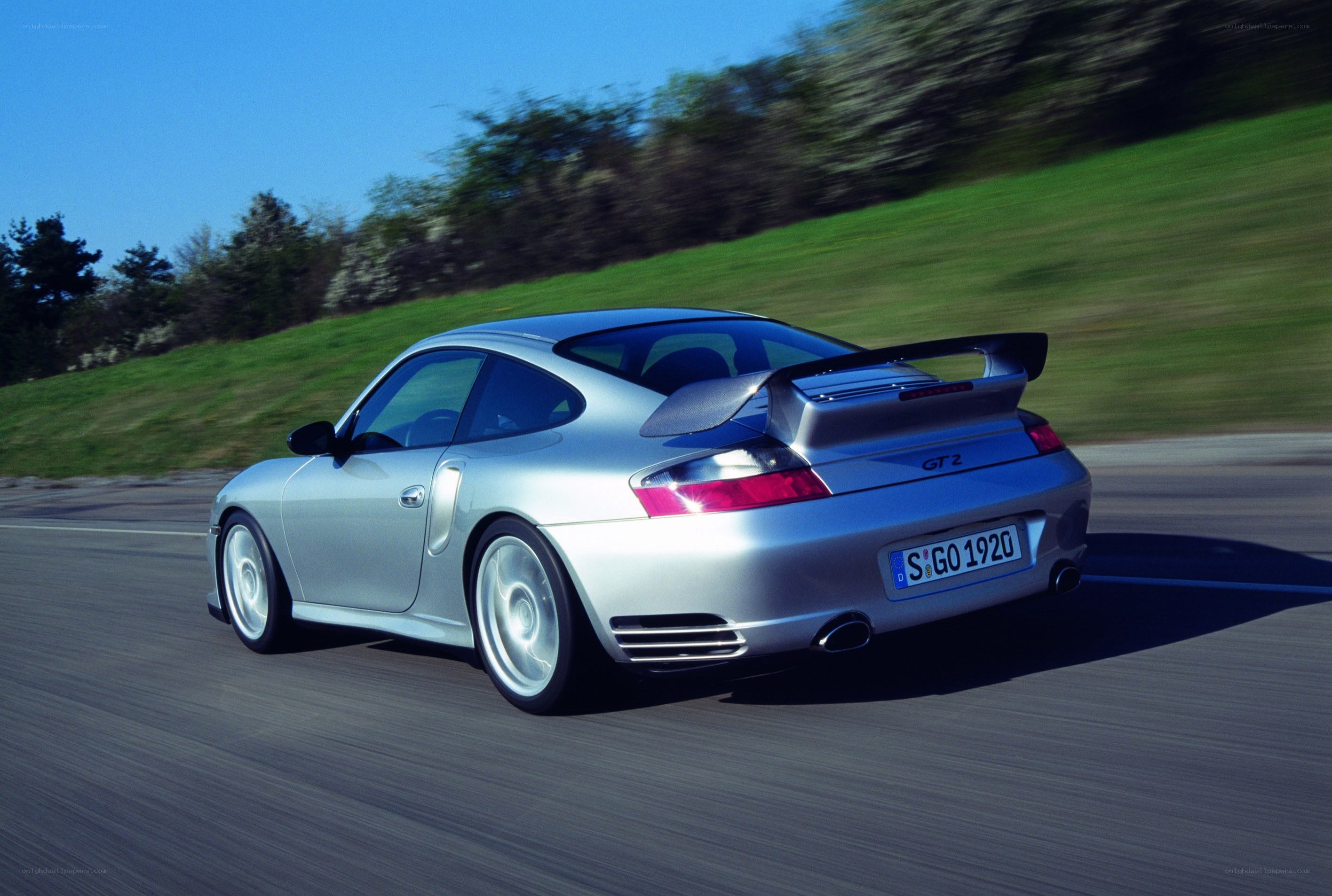 silver porsche gt2 in motion