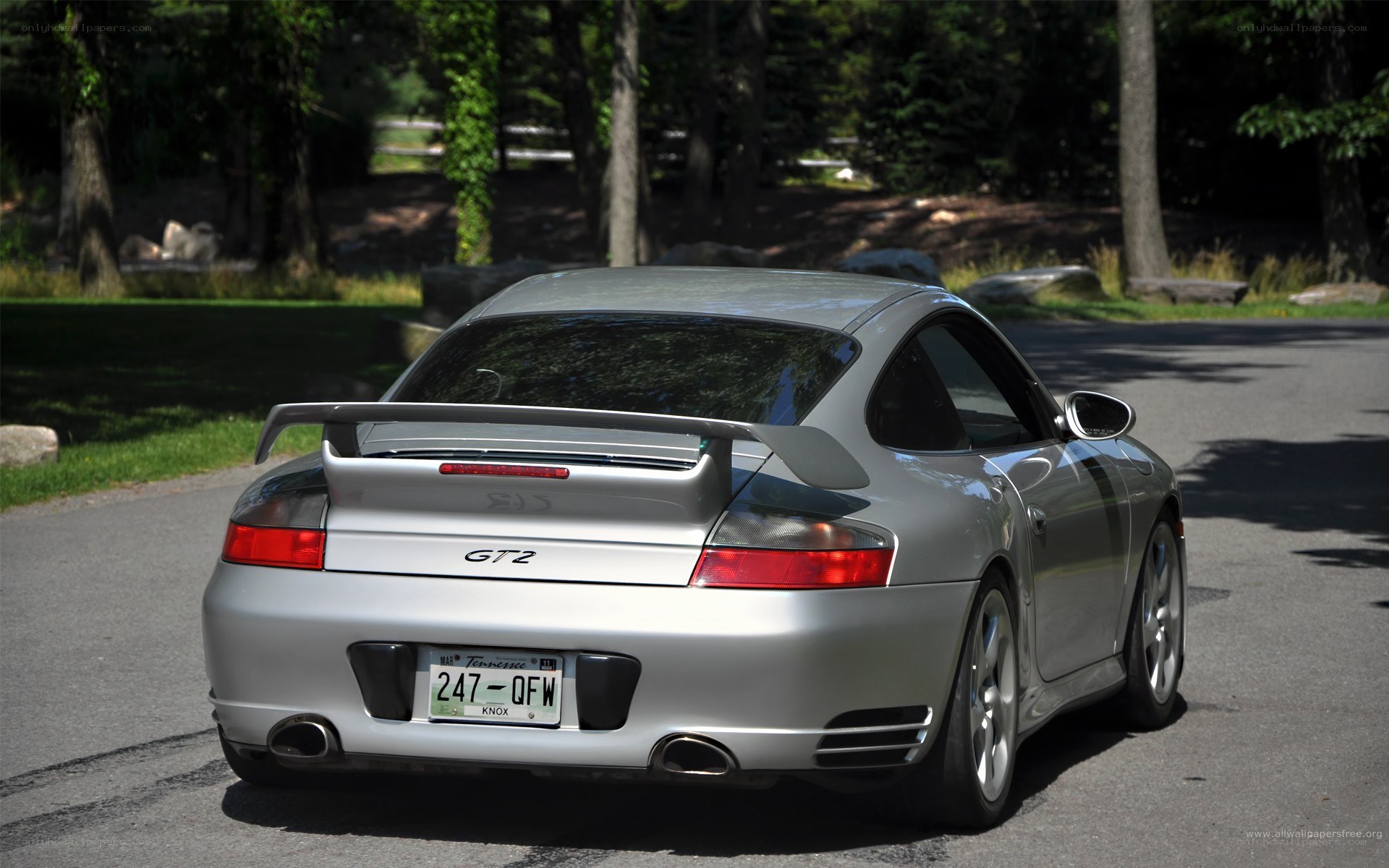 silver porsche gt2 rear view