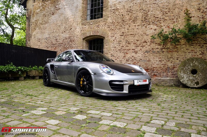 Silver Porsche GT2 RS on cobblestones