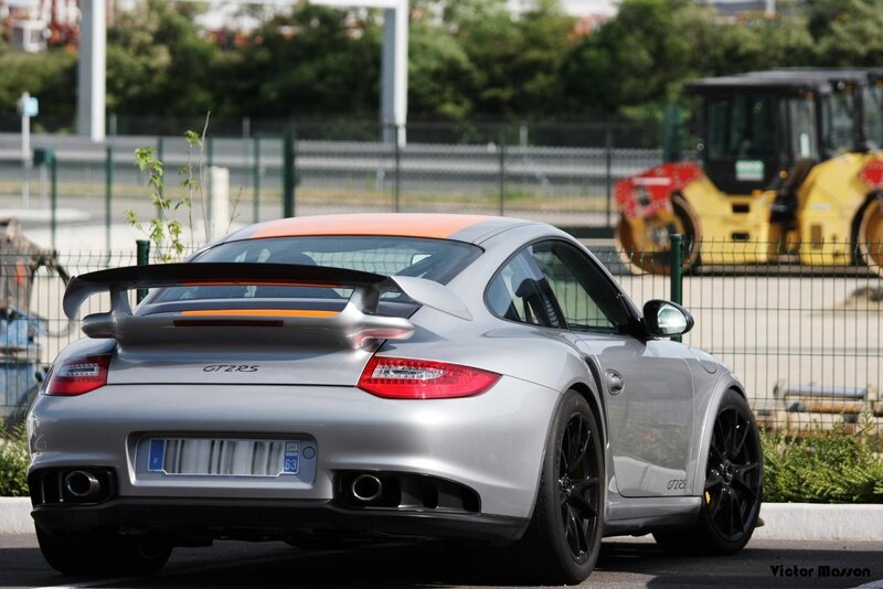 Silver Porsche GT2 RS with orange accents