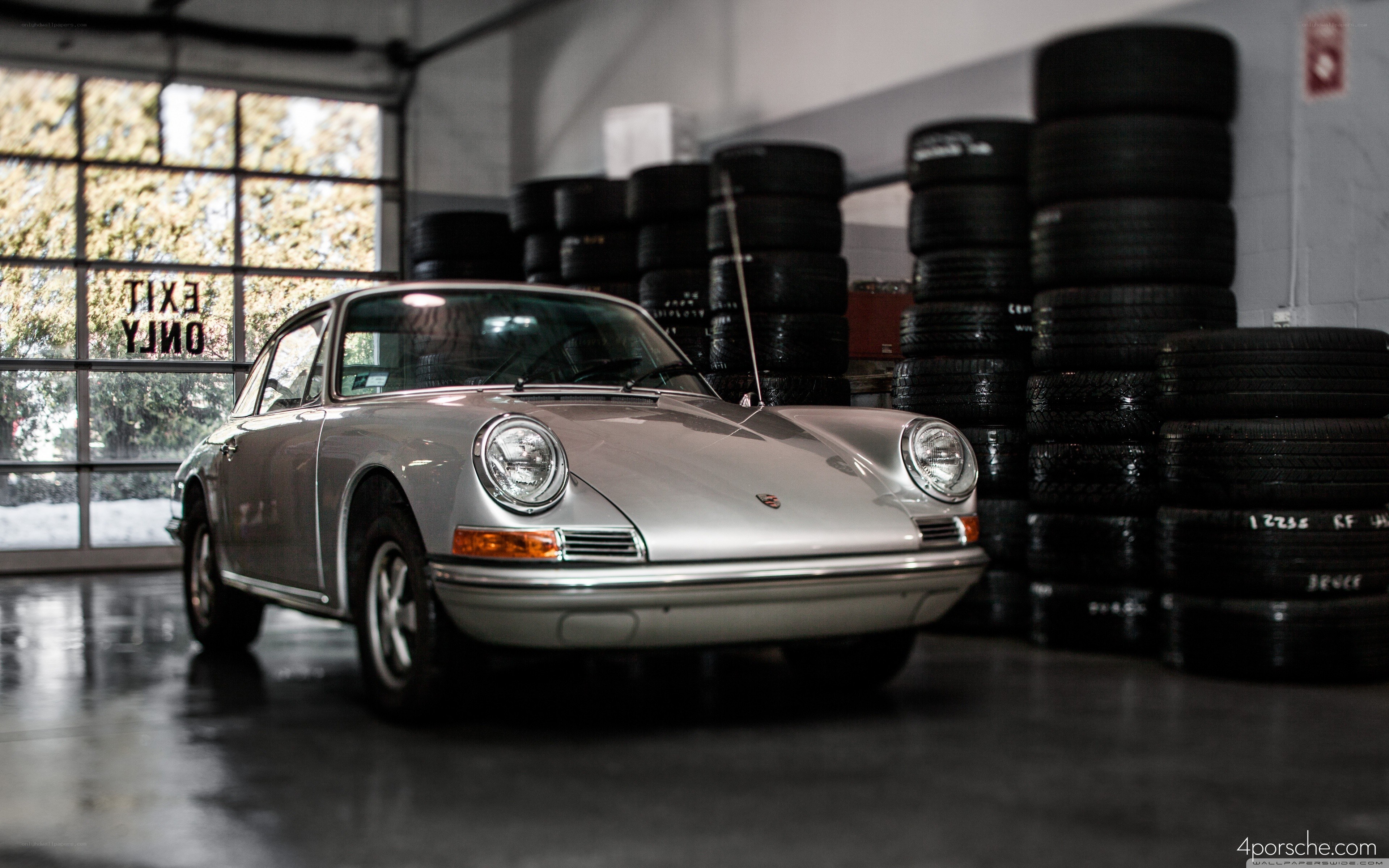Silver Porsche in a garage