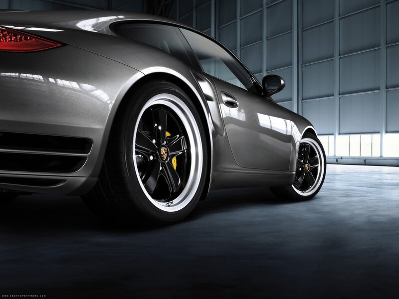 Silver Porsche in a garage