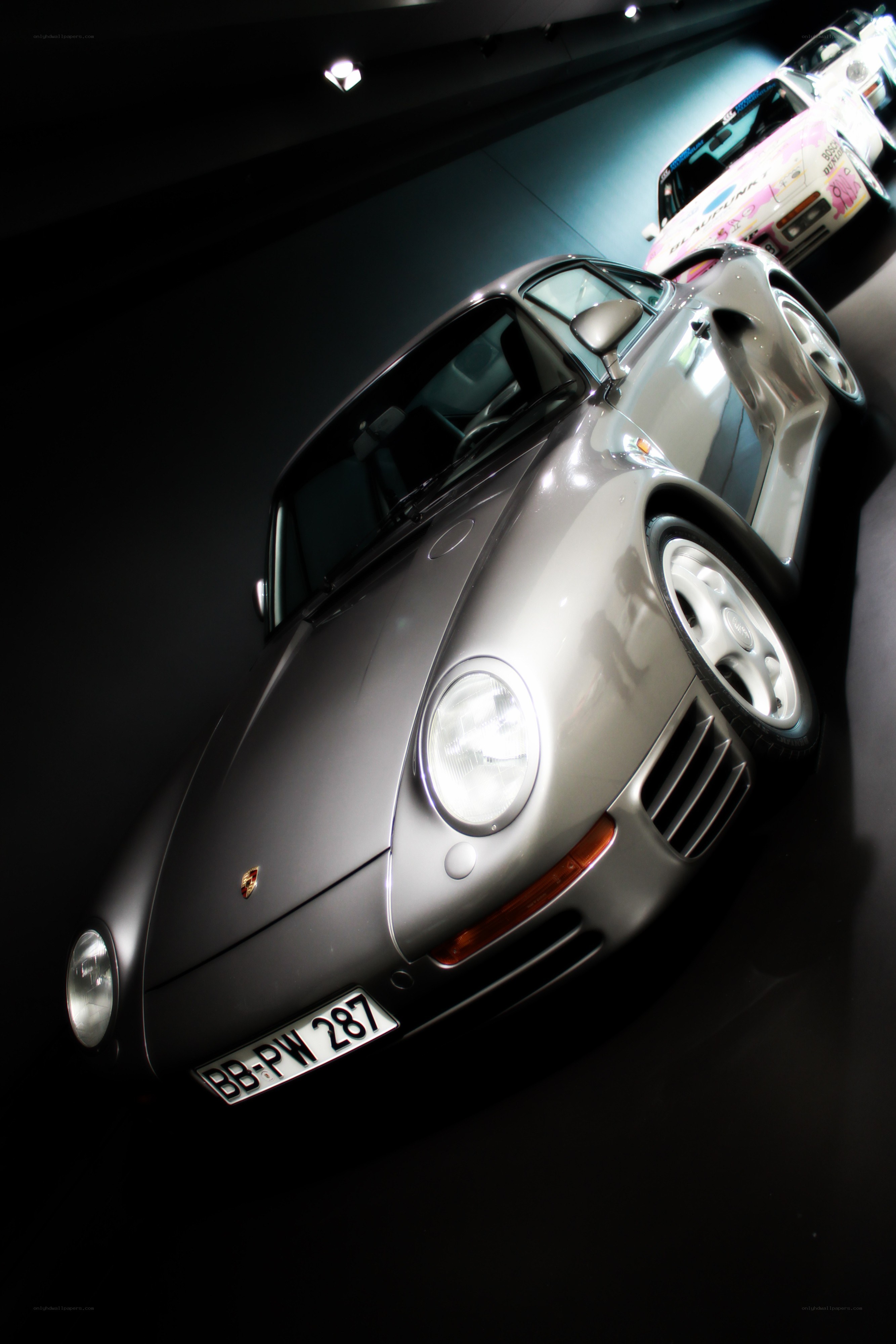 Silver Porsche in a showroom