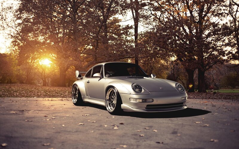Silver Porsche in autumn park