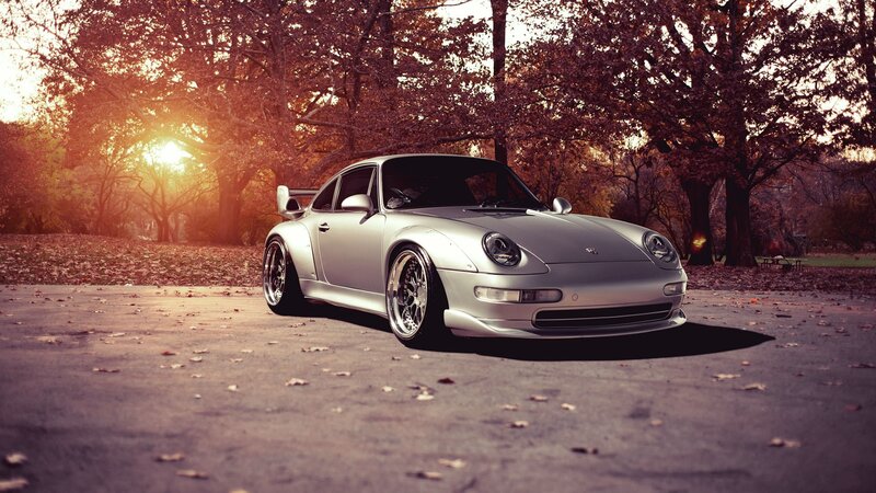 Silver Porsche in autumn park
