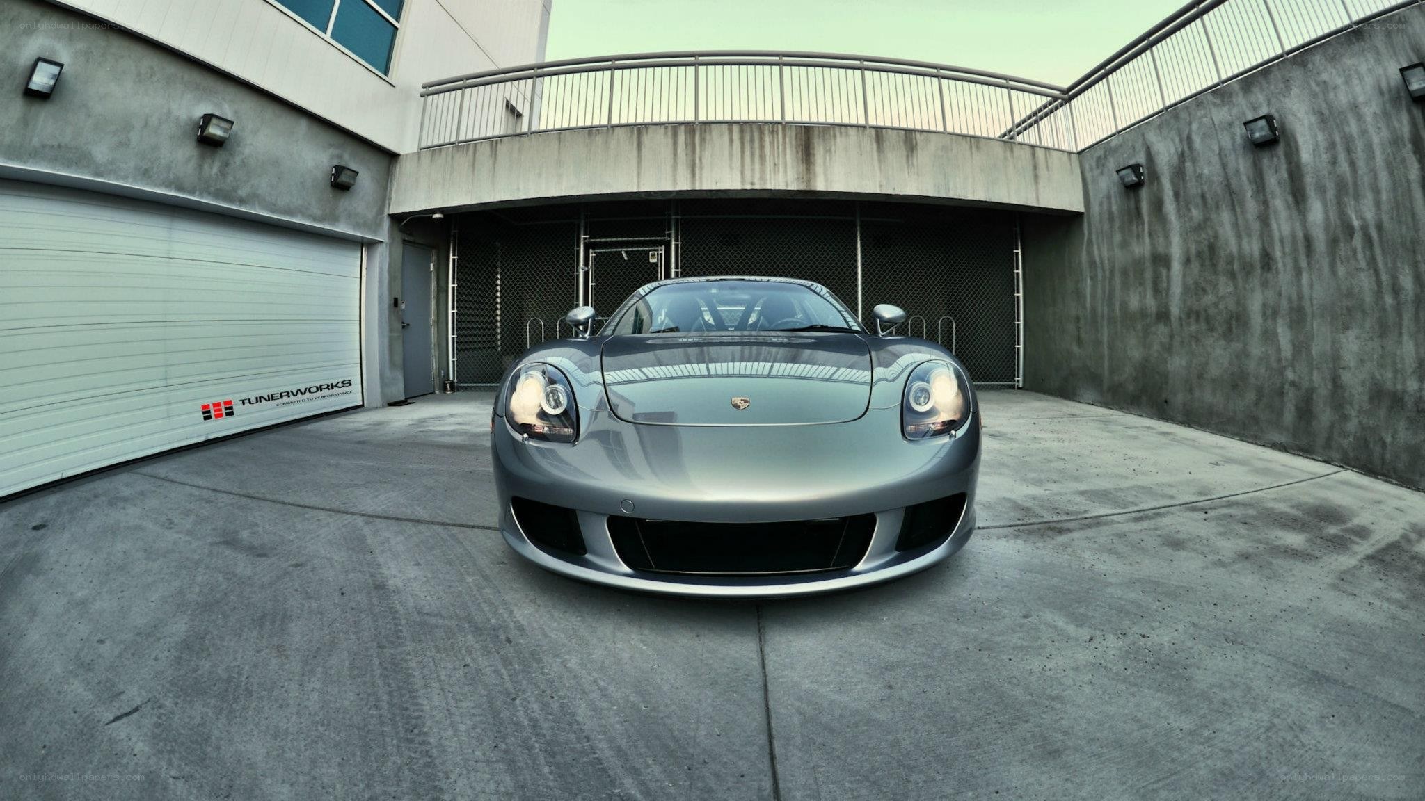 silver porsche in garage