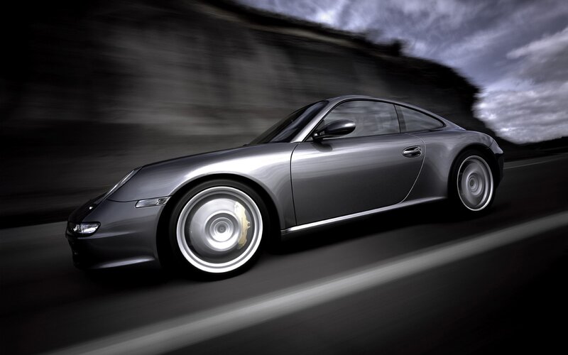 silver porsche in motion