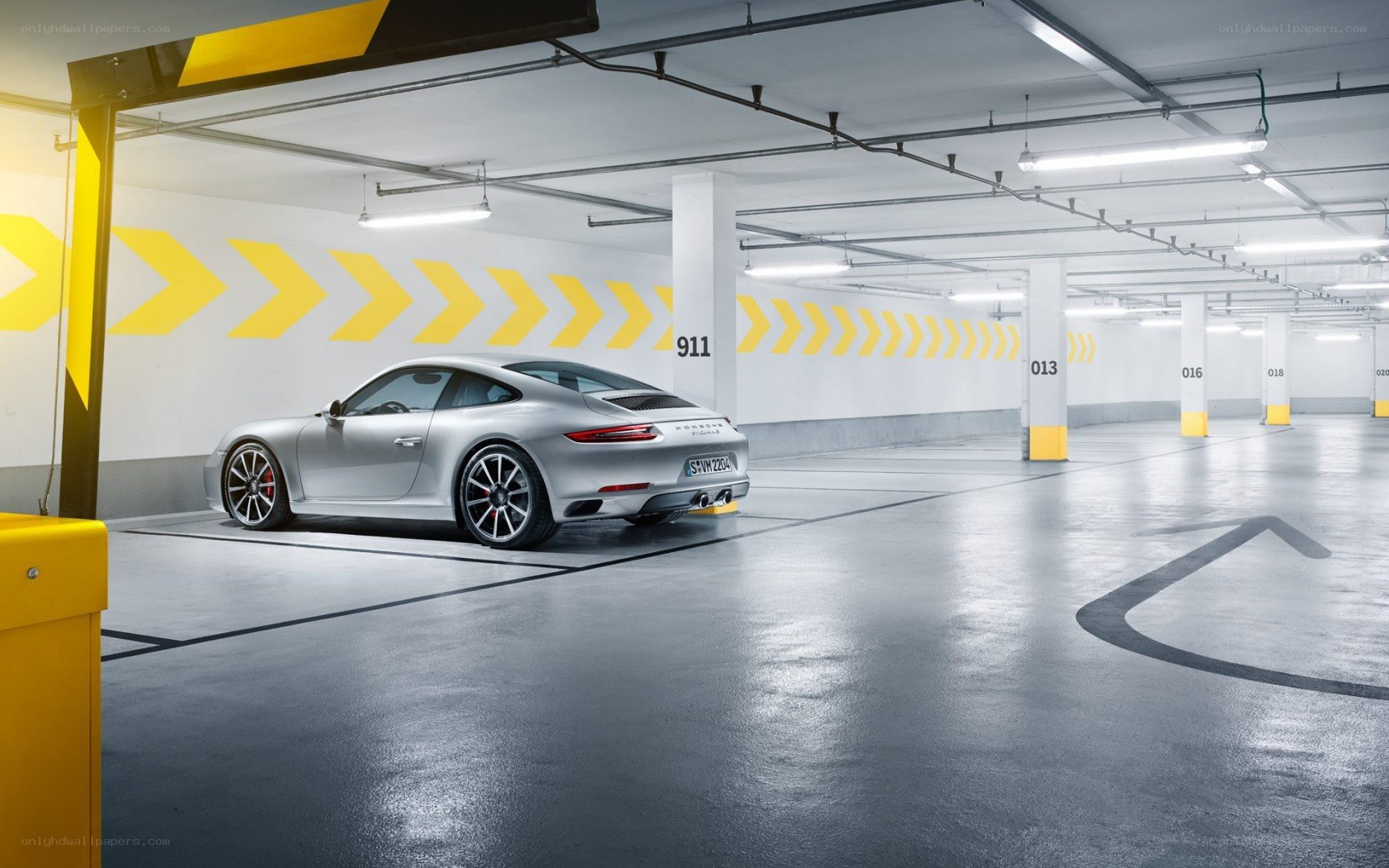 Silver Porsche in parking garage