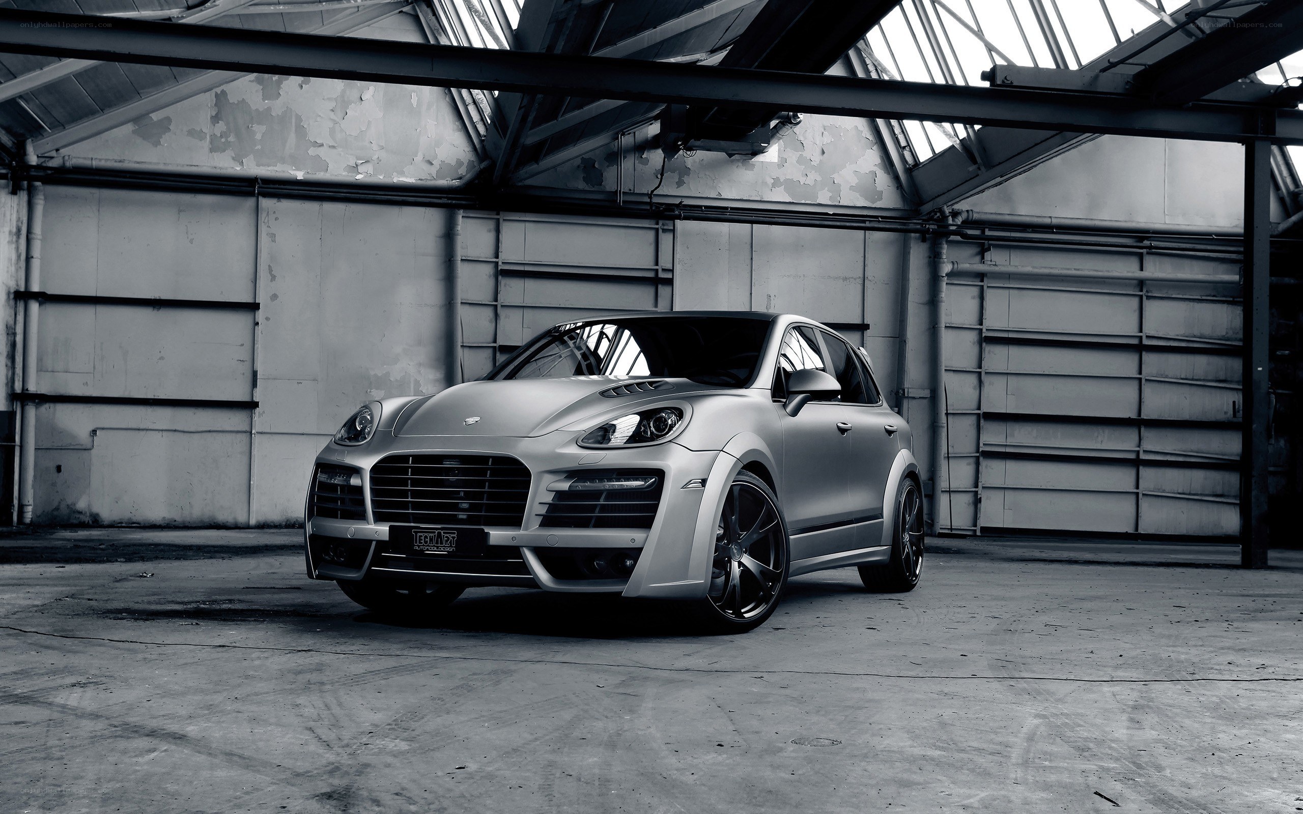 silver porsche in warehouse