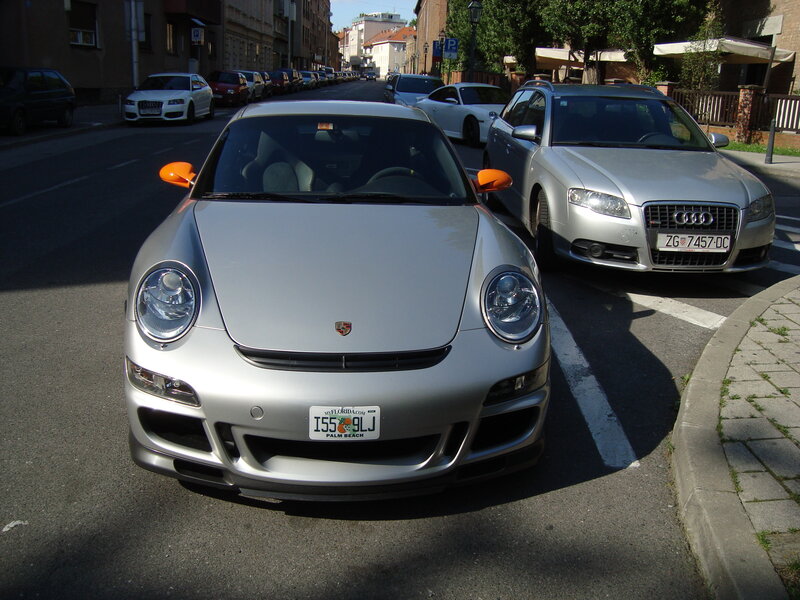 Silver Porsche on a city street