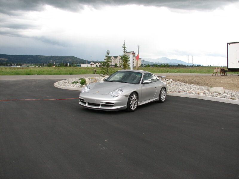 Silver Porsche on a cloudy day