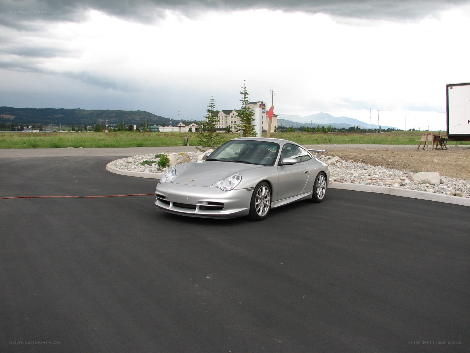 Silver Porsche on a cloudy day