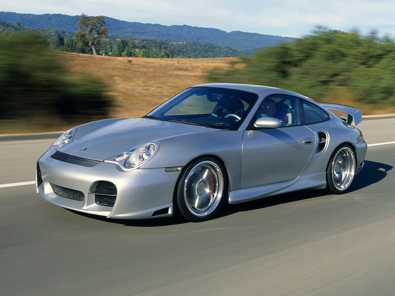 Silver Porsche on a country road