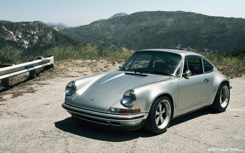 Silver Porsche on a mountain road
