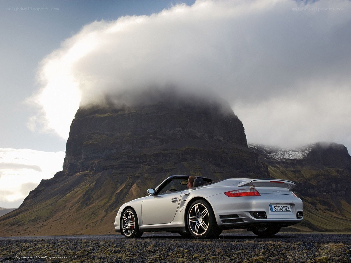 Silver Porsche on a mountain road