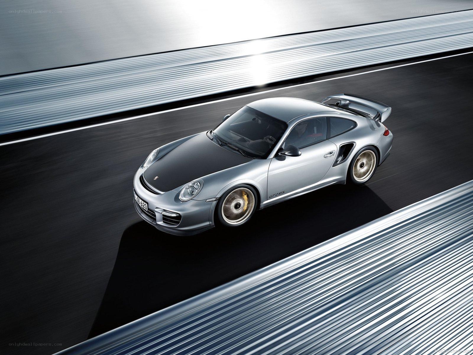 Silver Porsche on a racetrack