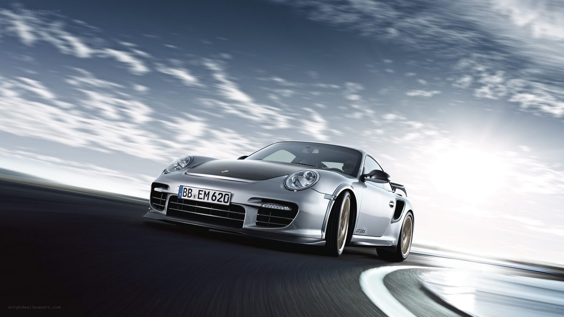 silver porsche on a racetrack