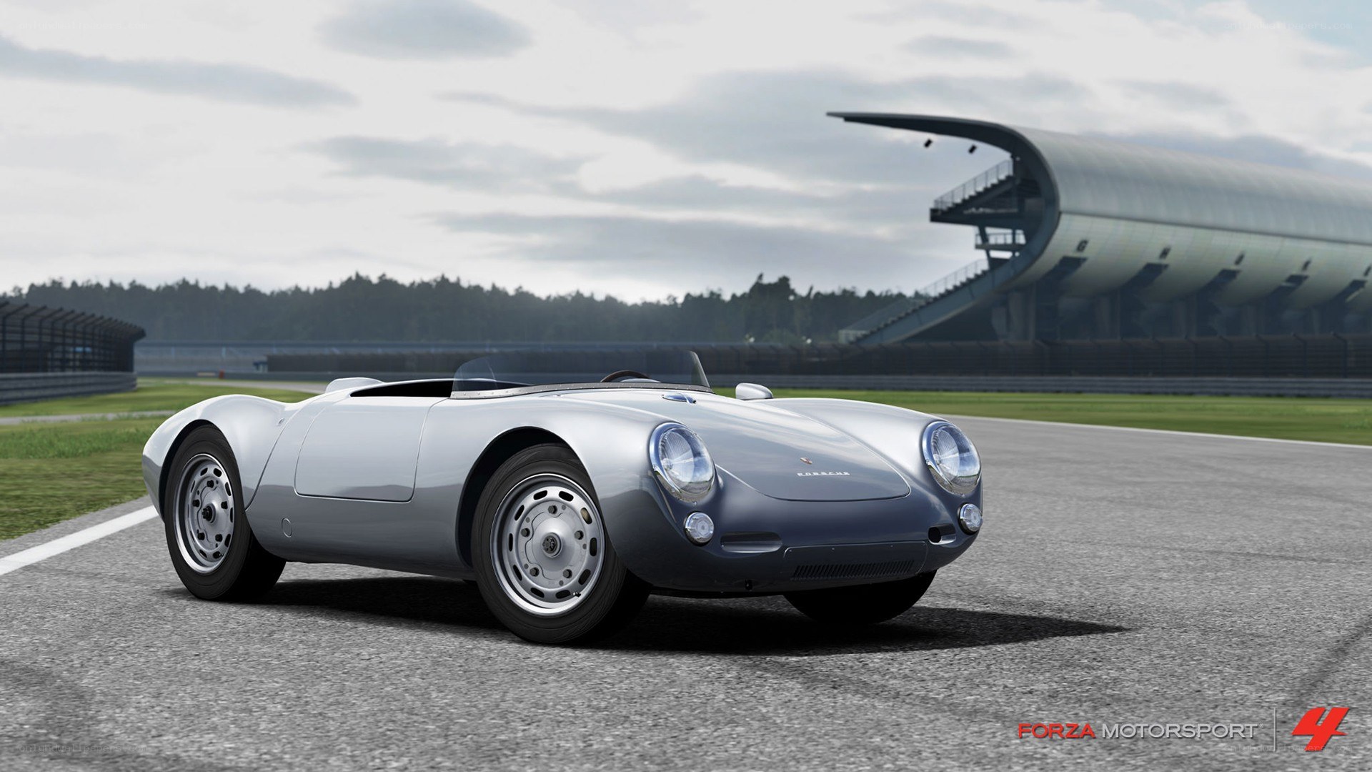 Silver Porsche on a racetrack
