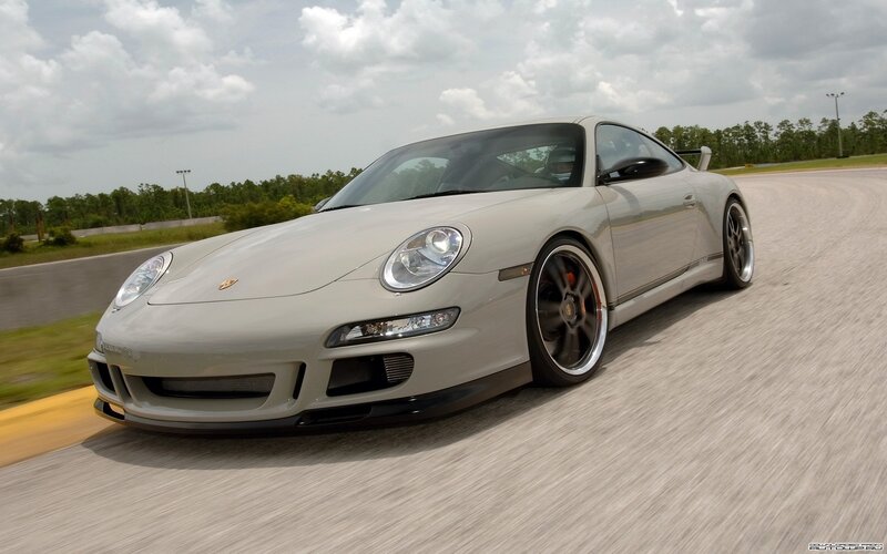silver porsche on a racetrack