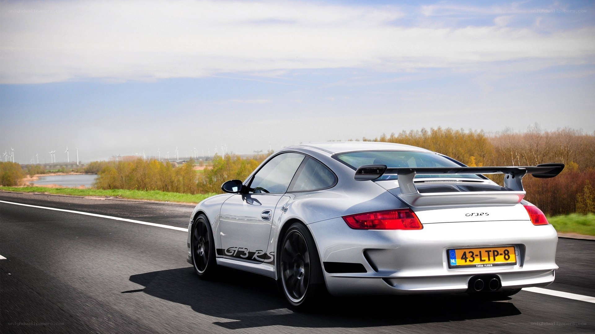 silver porsche on a road