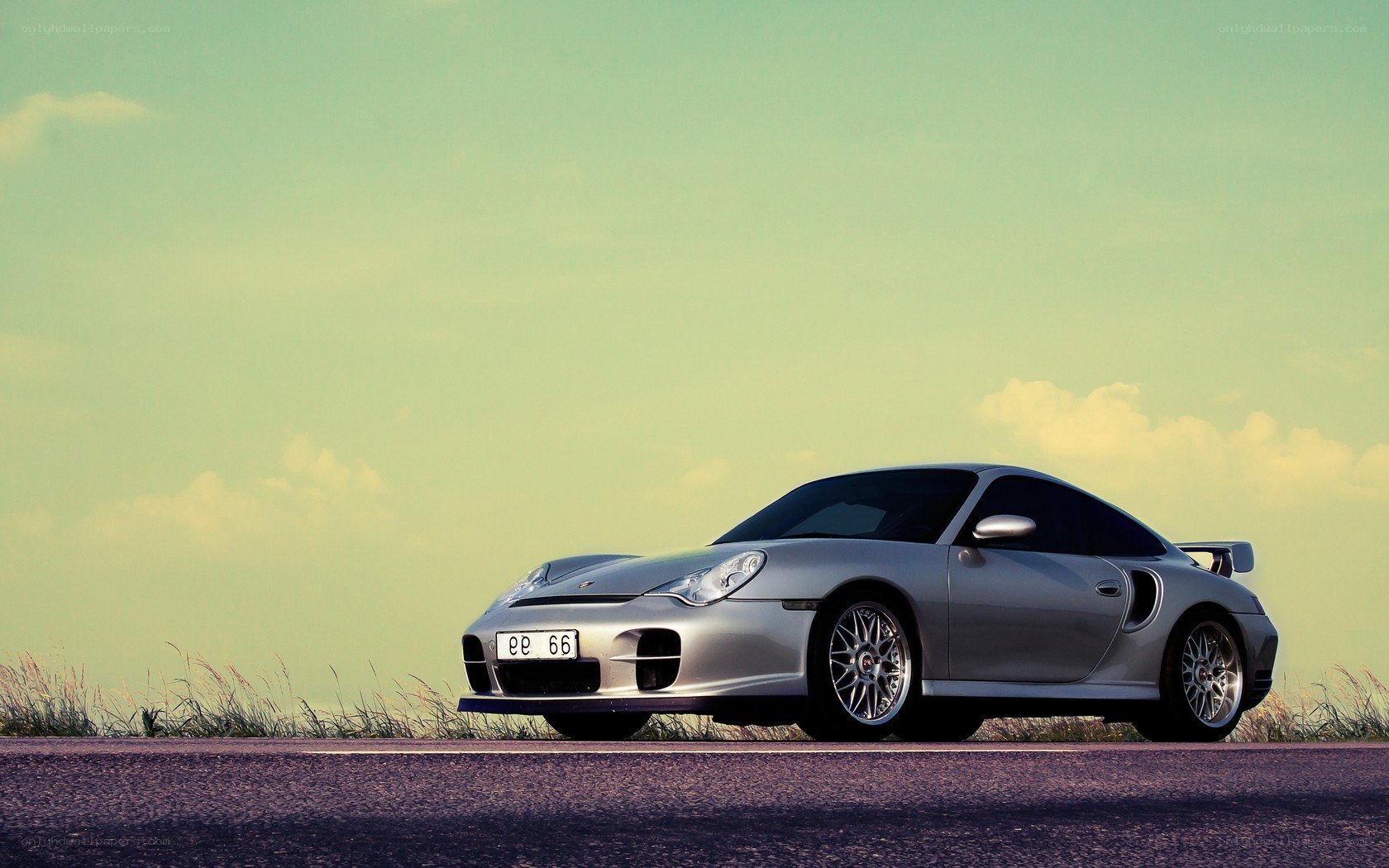 silver porsche on a road