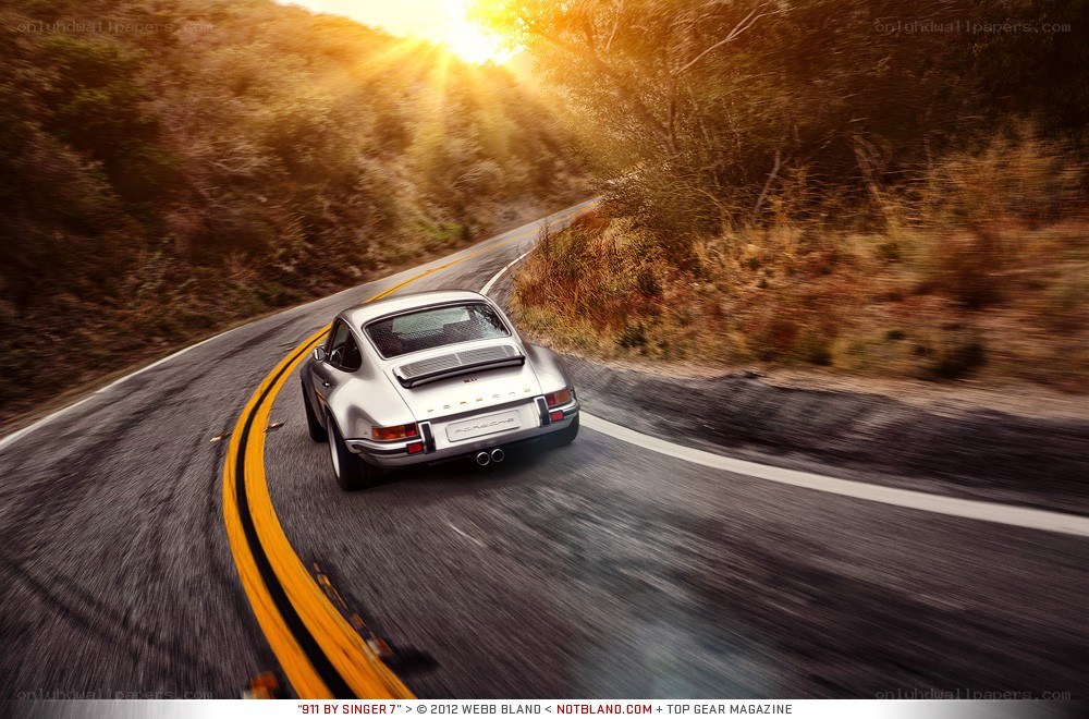 Silver Porsche on a winding road