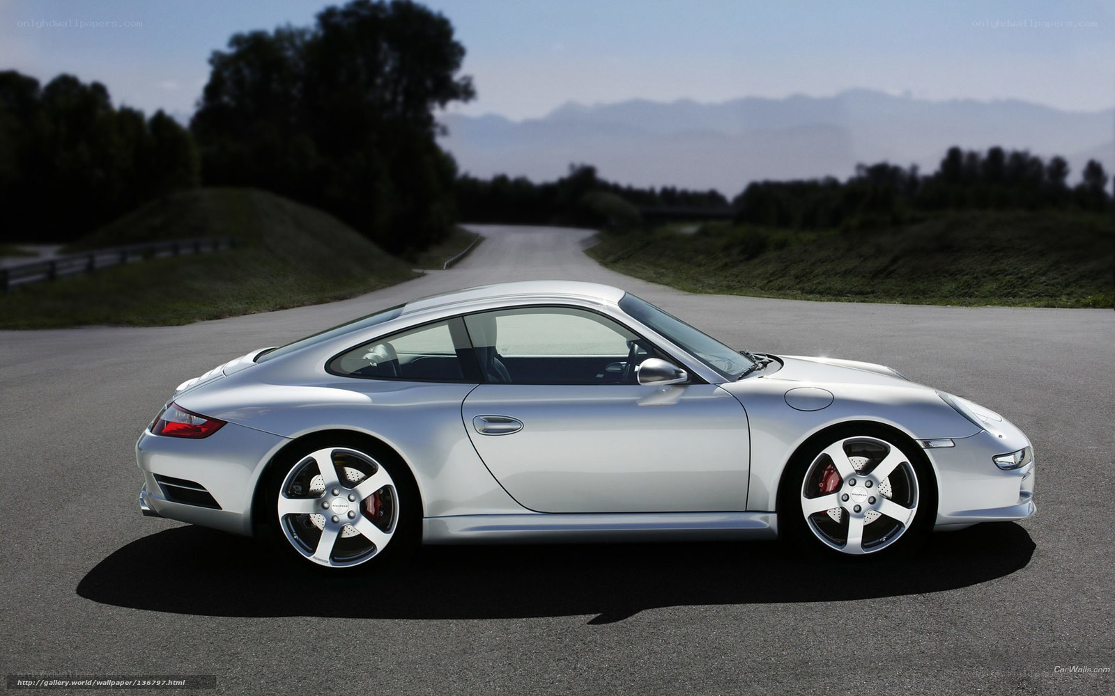 silver porsche on a winding road
