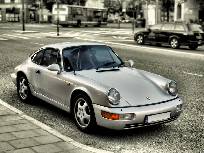 Silver Porsche on city street