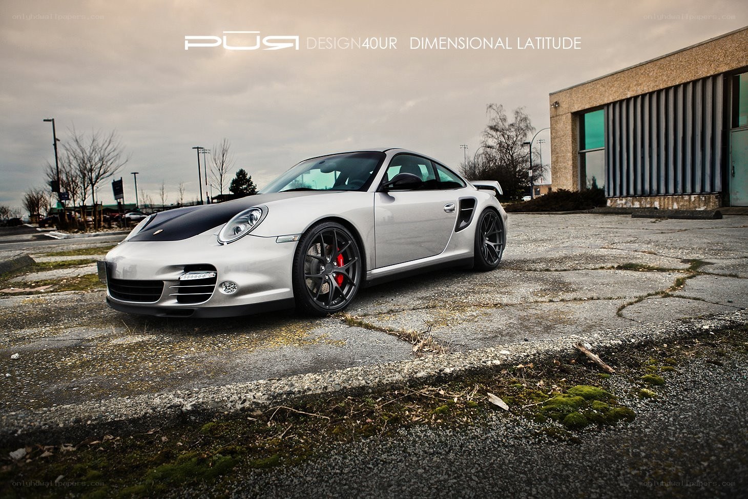 silver porsche on cracked pavement