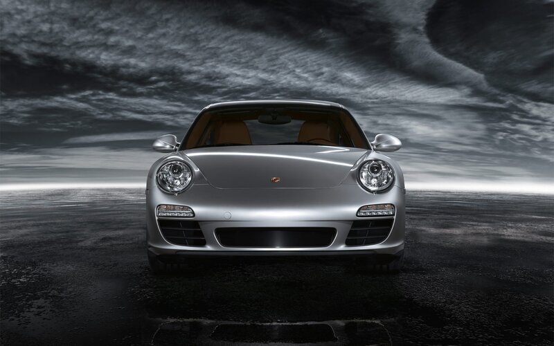Silver Porsche on dark road
