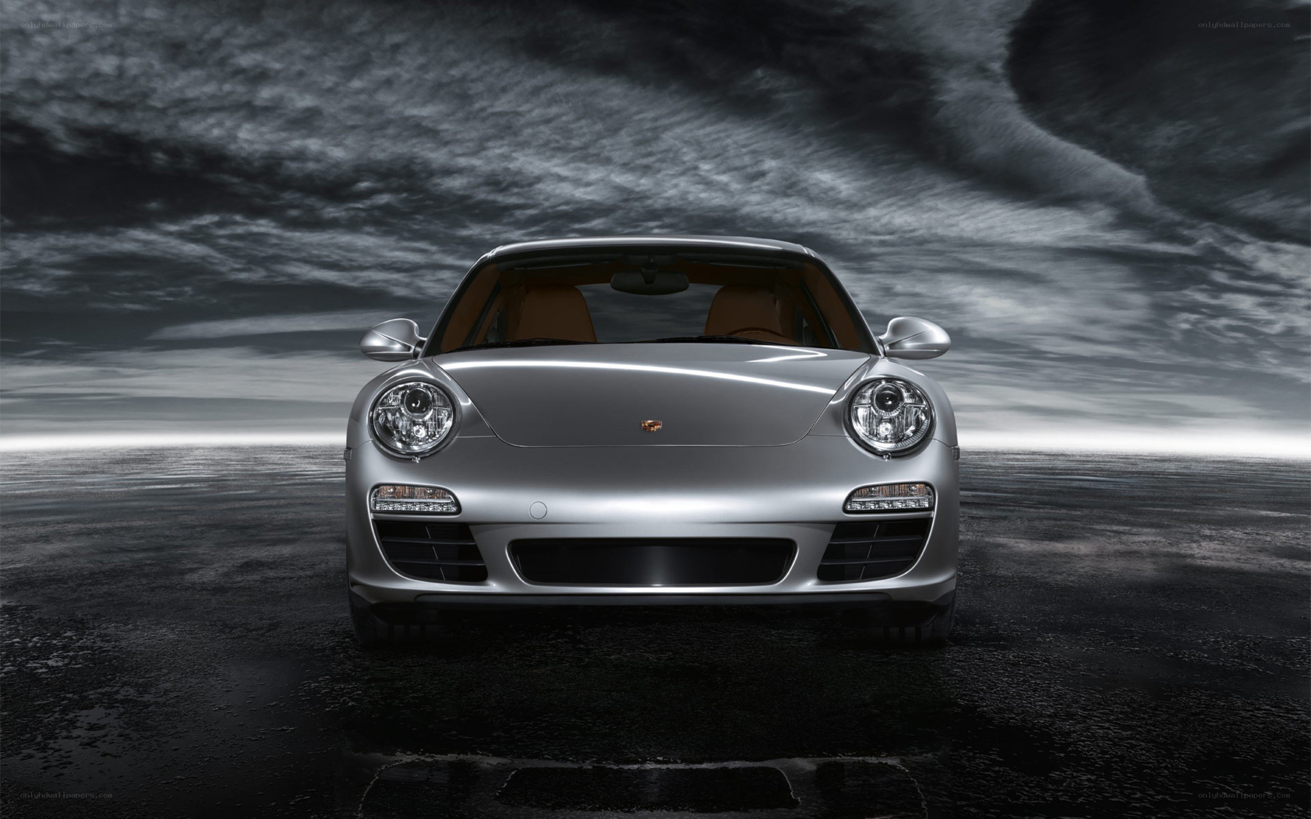 Silver Porsche on dark road