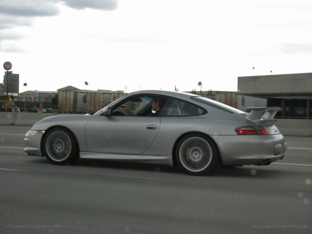 silver porsche on highway