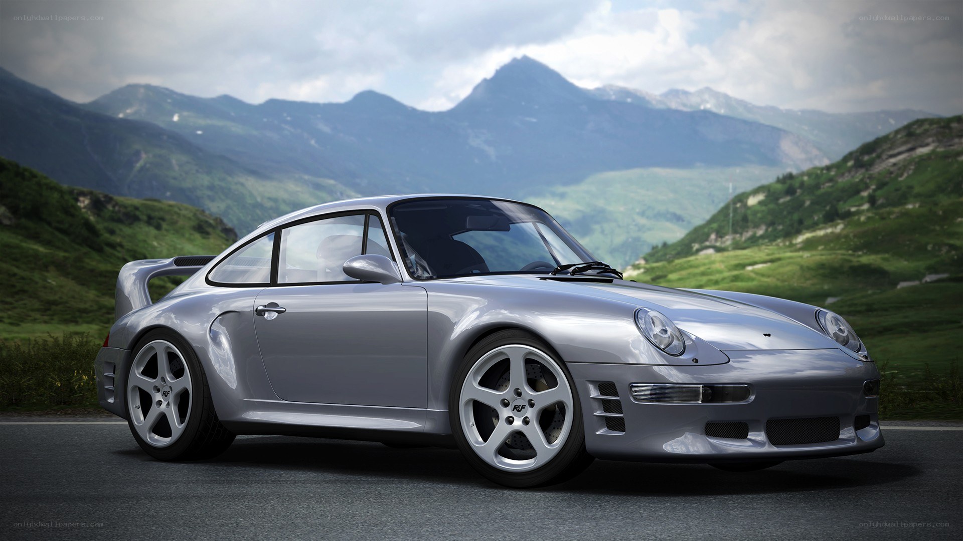 silver porsche on mountain road