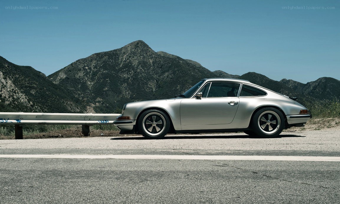 Silver Porsche on mountain road