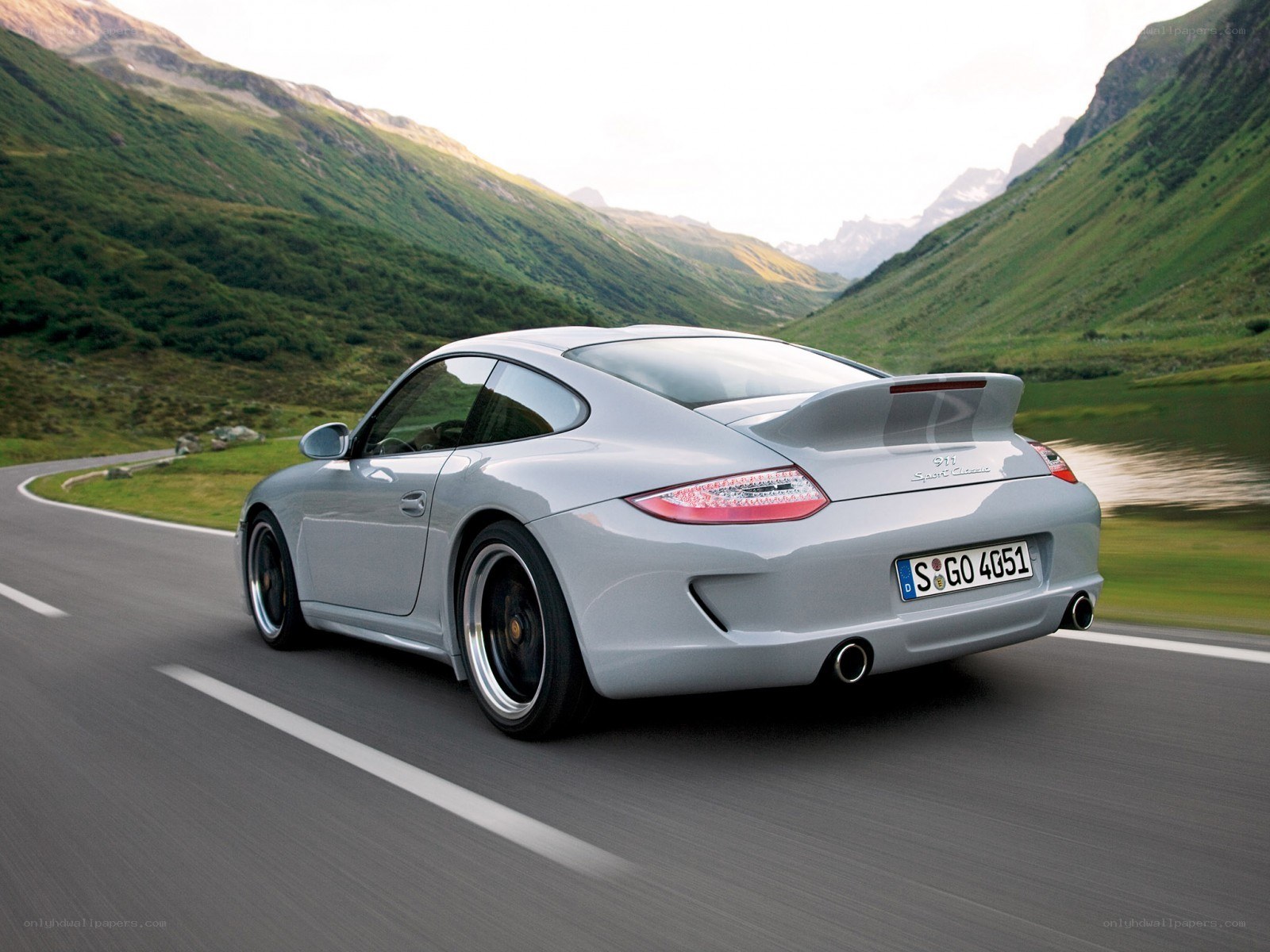 Silver Porsche on mountain road