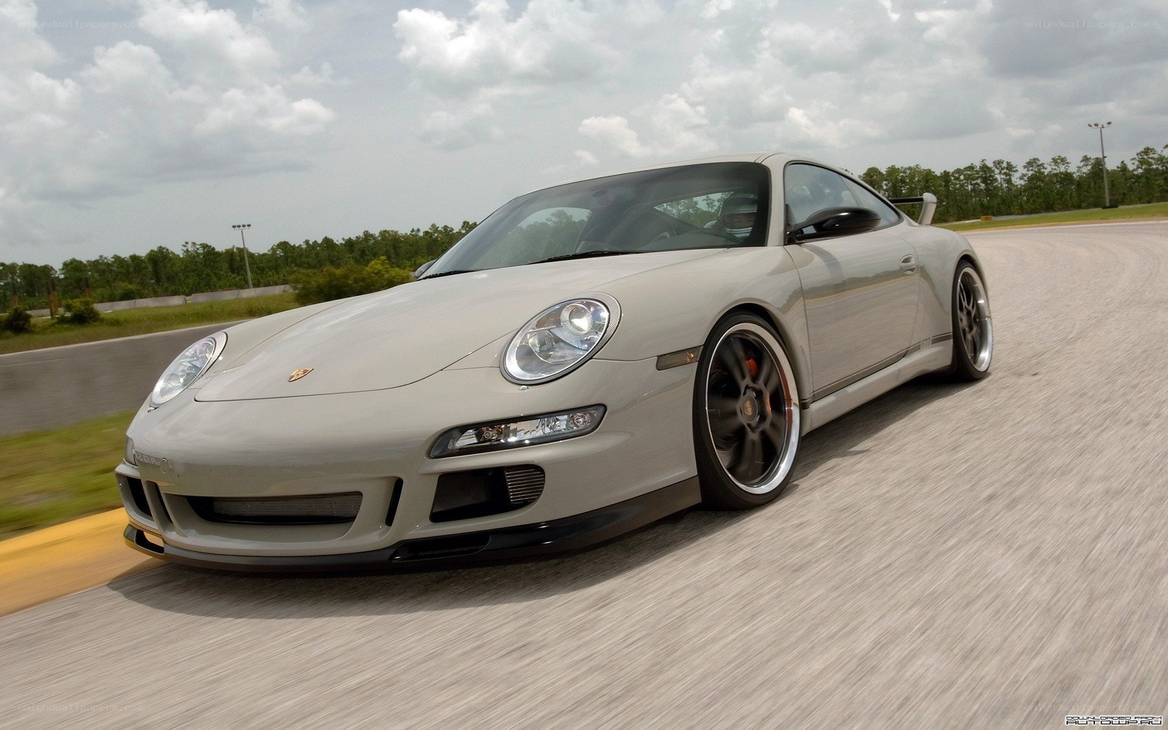 silver porsche on racetrack