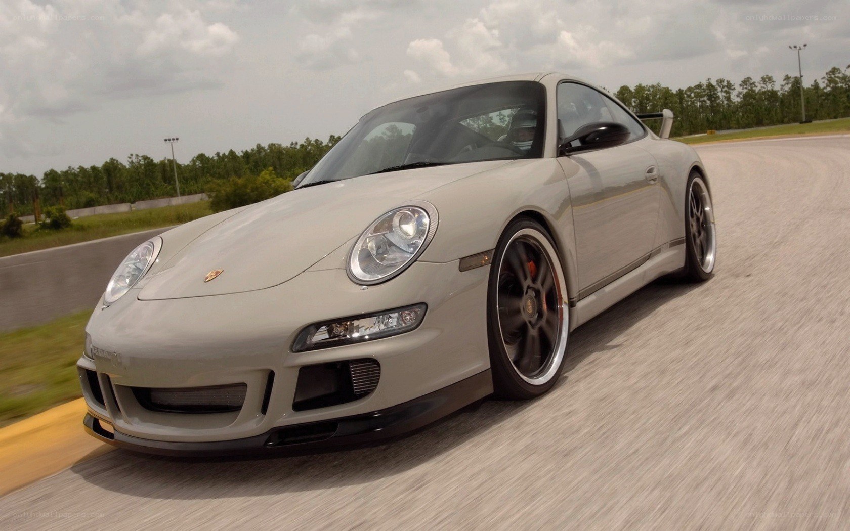 silver porsche on racetrack