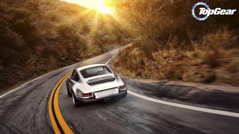 silver porsche on winding road