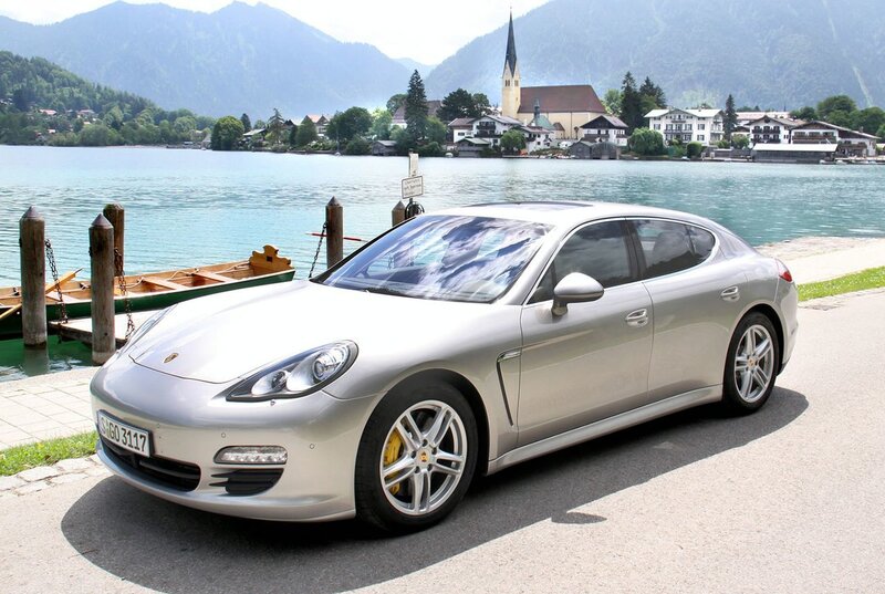 Silver Porsche Panamera by a lake